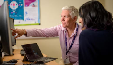 Team of IT support professionals working together illustrating outsourced IT support services.